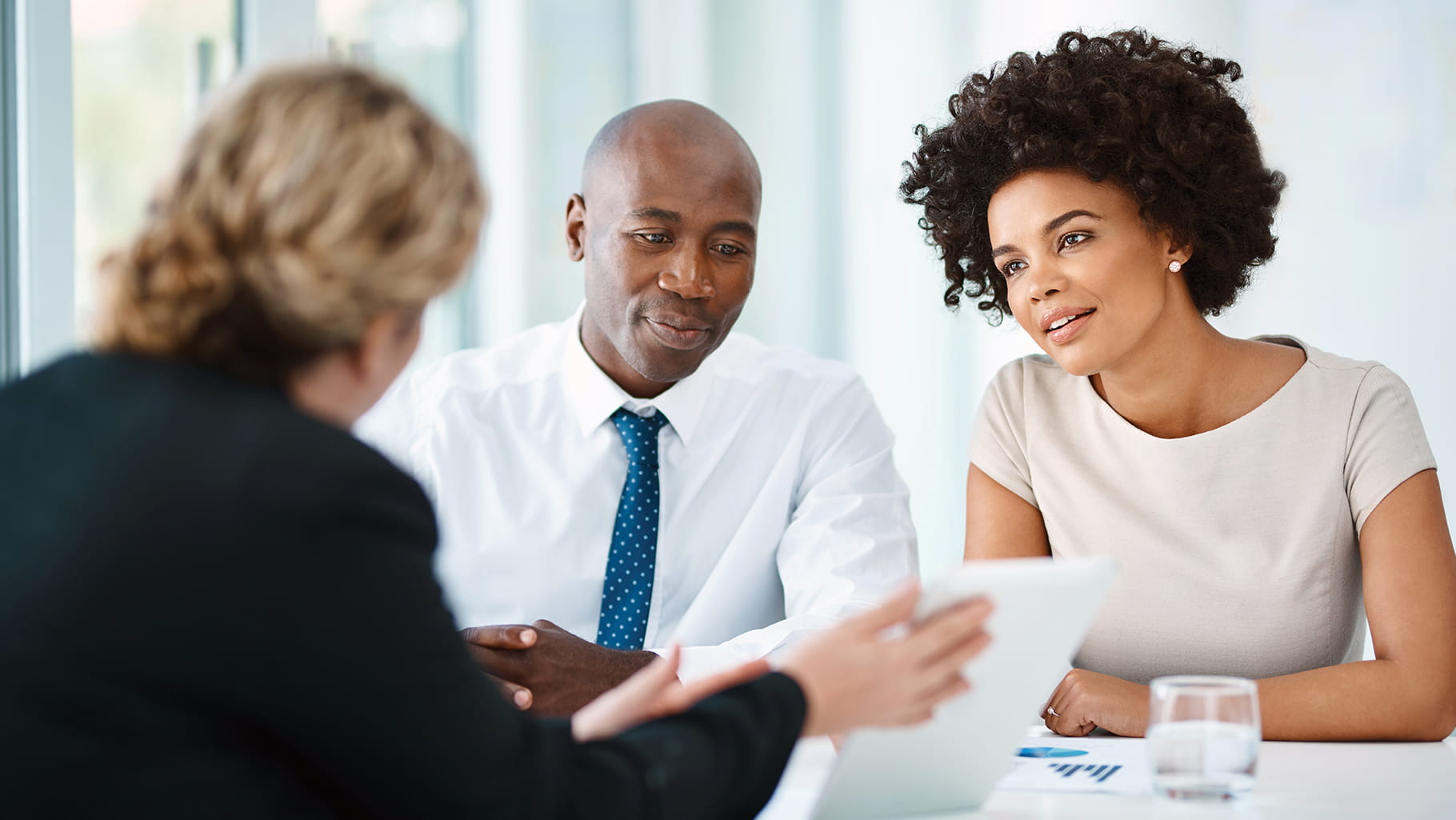 three professionals financial meeting