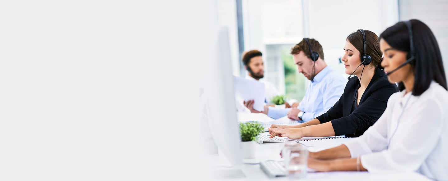 4 call center reps at workstations