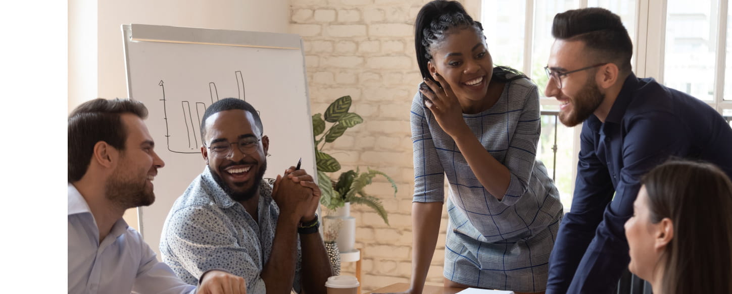 A group of coworkers talking and laughing