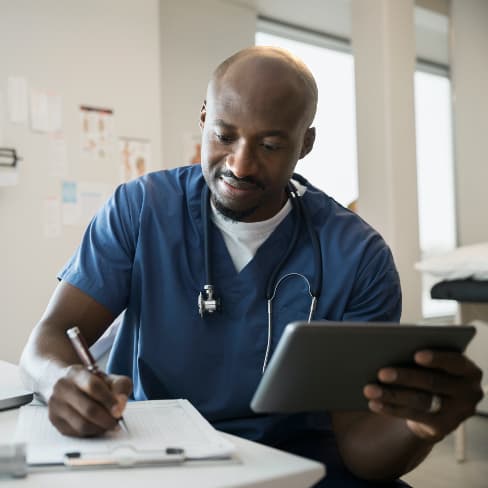 healthcare worker completing medical documentation