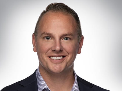 A headshot of Trevor Hawkins