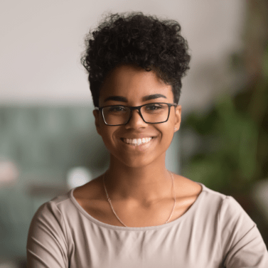 Head shot of young woman with afro