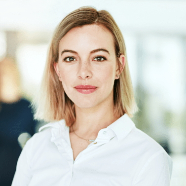Head shot of blonde woman in white shirt